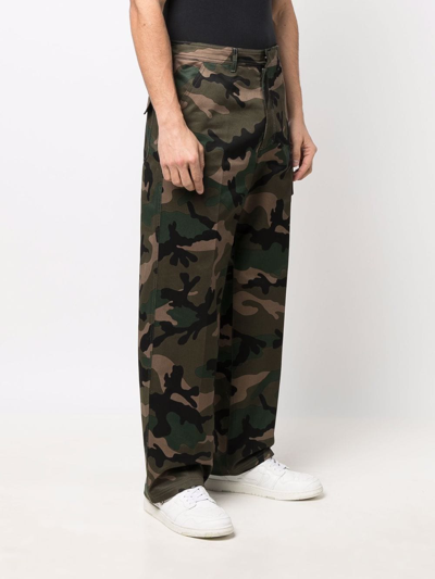 Shop Valentino Camou Print Cotton Trousers In Camouflage