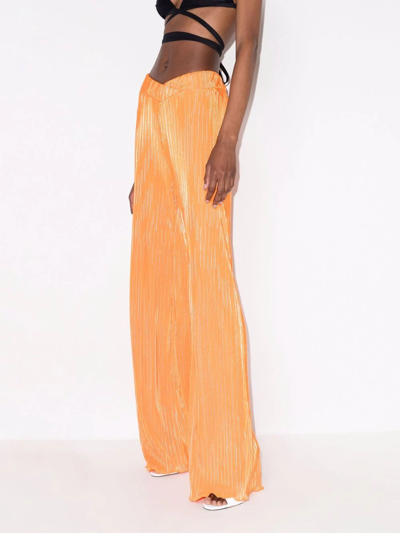 Shop Rotate Birger Christensen Briella Plissé Trousers In Orange