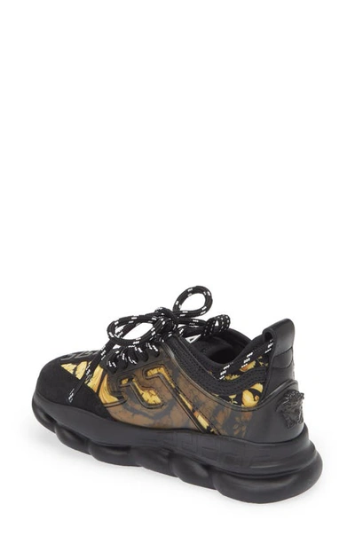 Shop Versace Chain Reaction Sneaker In Black Gold