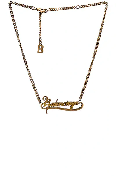 Shop Balenciaga Typo Valentine Necklace In Antique Gold
