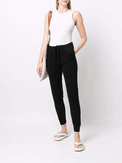 Shop Paula Tapered-leg Cashmere Trousers In Black