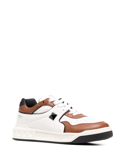 Shop Valentino Roman Stud Low-top Sneakers In White