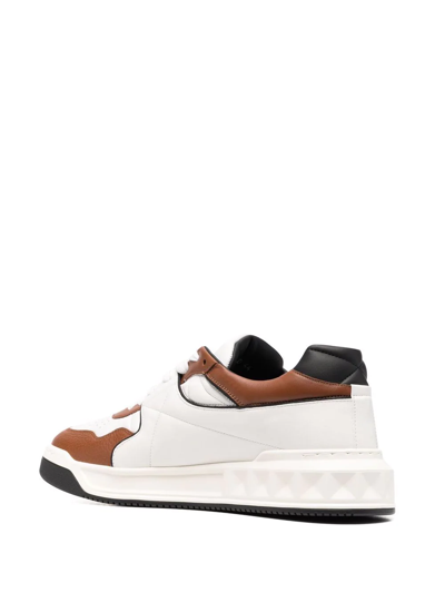 Shop Valentino Roman Stud Low-top Sneakers In White