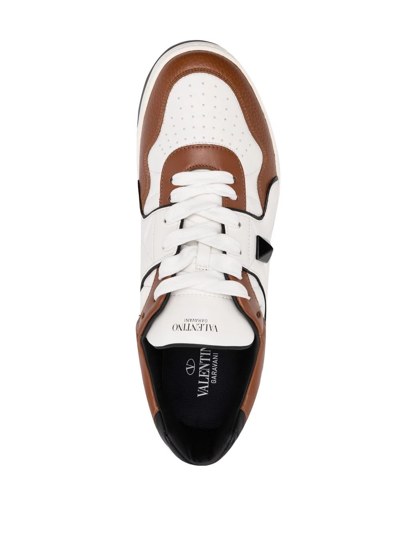 Shop Valentino Roman Stud Low-top Sneakers In White