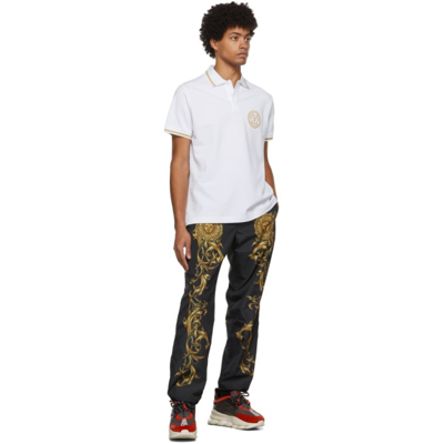 Shop Versace Jeans Couture White Emblem Polo In Eg03 White + Gold