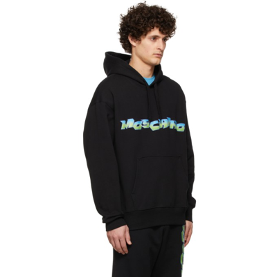 Shop Moschino Black Logo Hoodie In A1555 Fantasy Print