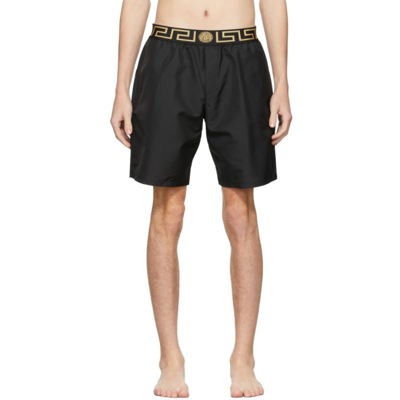 Shop Versace Black Mid-length Greca Border Swim Shorts In A80g Black