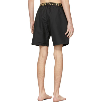 Shop Versace Black Mid-length Greca Border Swim Shorts In A80g Black