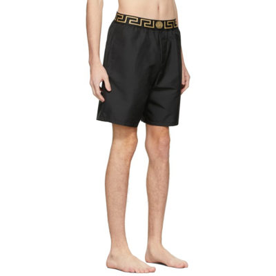 Shop Versace Black Mid-length Greca Border Swim Shorts In A80g Black