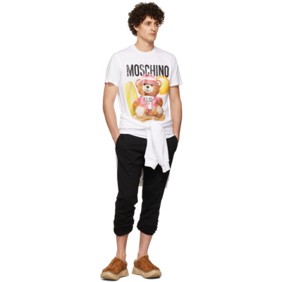 Shop Moschino White Graphic Print T-shirt In V1001 Fantasy Print