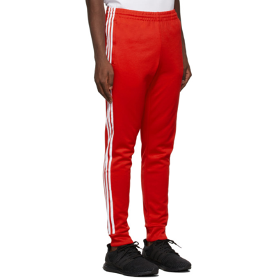Shop Adidas Originals Red Adicolor Classics Primeblue Sst Track Pants In Vivid Red