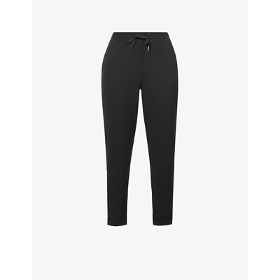 Shop Spanx Active Women's Very Black Tapered Mid-rise Stretch-jersey Jogging Bottoms