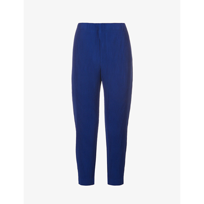 Shop Issey Miyake Pleated Relaxed-fit Tapered Woven Trousers In Ultramarine Blue