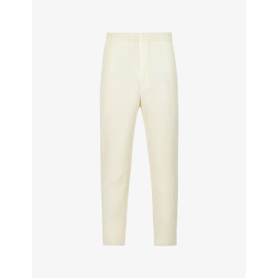 Shop Issey Miyake Pleated Relaxed-fit Tapered Woven Trousers In Vanilla Beige