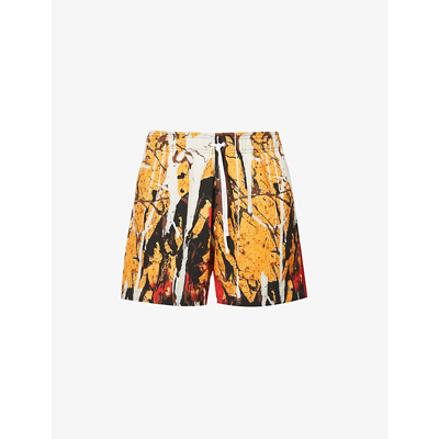 Shop Amiri Paint-print Swim Shorts In Yellow