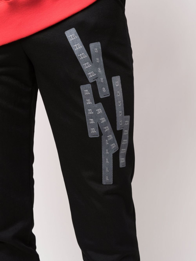 Shop Doublet Label-print Straight-leg Trousers In Black