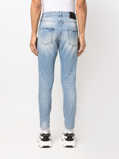 Shop John Richmond Slim-cut Distressed Jeans In Blue