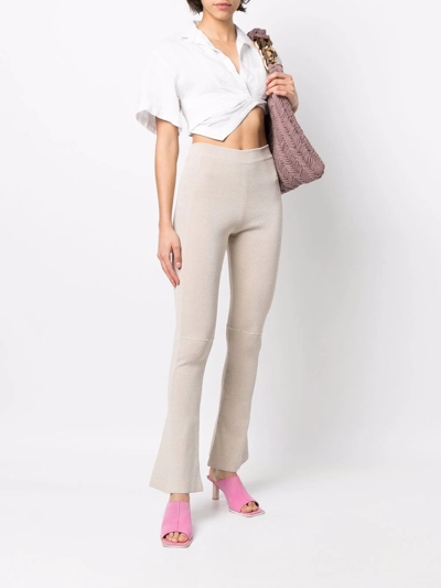 Shop Jacquemus Flared Knitted Trousers In Neutrals