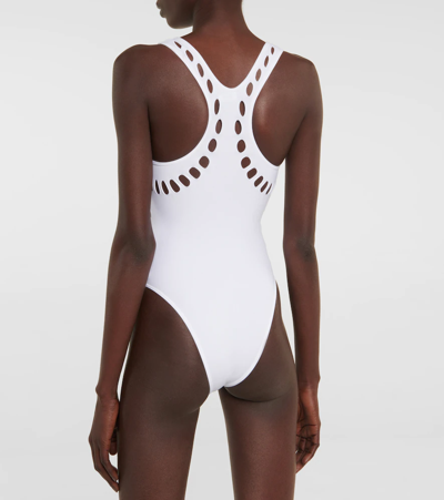 Shop Alaïa Cutout Racerback Swimsuit In White