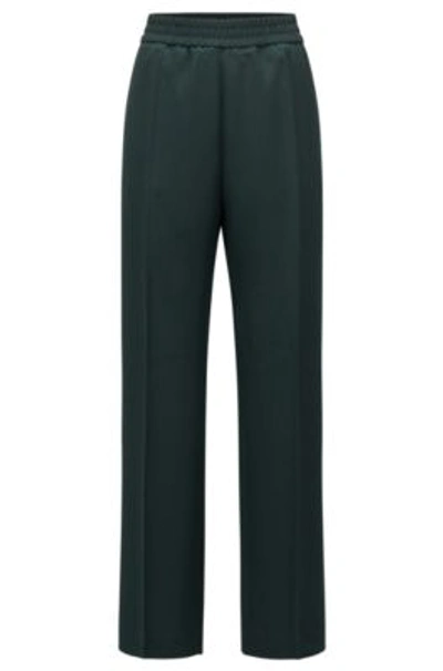 Shop Hugo Boss Relaxed-fit Trousers In Fluent Crepe With Elasticized Waistband In Light Green