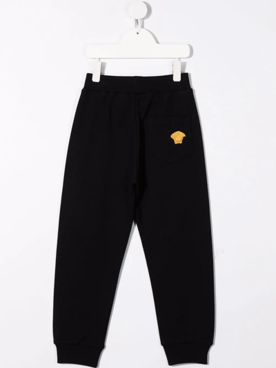 Shop Versace Elasticated Track Pants In Black