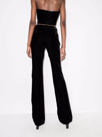Shop Saint Laurent Flared Velvet Trousers In Black