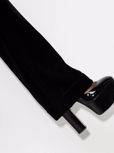 Shop Saint Laurent Flared Velvet Trousers In Black