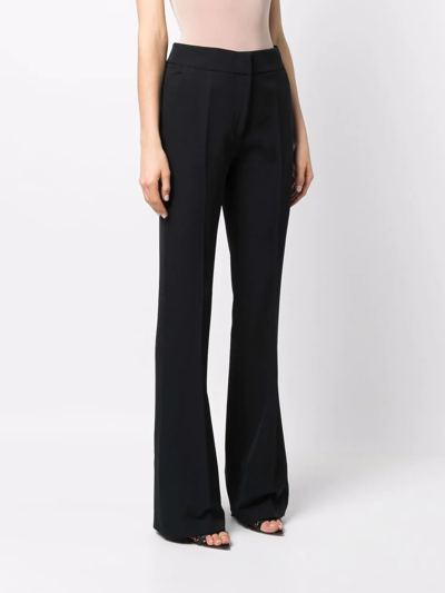 Shop Genny High-waisted Flared Trousers In Black