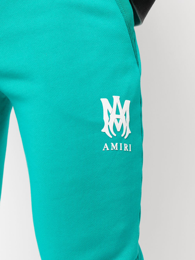 Shop Amiri Logo-print Cotton Track Trousers In Blue