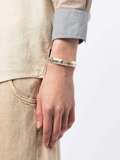 Shop Undercover Slogan Engraved Cuff In Silver