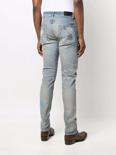 Shop Amiri Distressed-finish Skinny Jeans In Blue