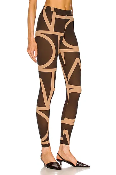 Shop Totême Monogram Legging In Brown Monogram