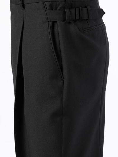 Shop Juunj Waist-buckle Ankle-crop Trousers In Black
