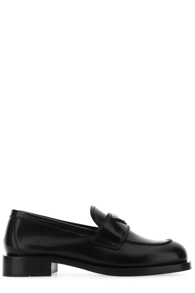 Shop Prada Logo Plaque Brushed Loafers In Black