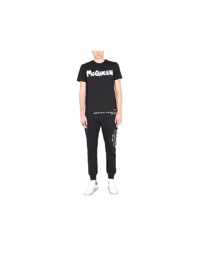 Shop Alexander Mcqueen Cotton Jogging Pants With Graffiti Logo In Black