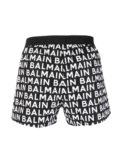 Shop Balmain All-over Logo-print Swim Shorts In Schwarz