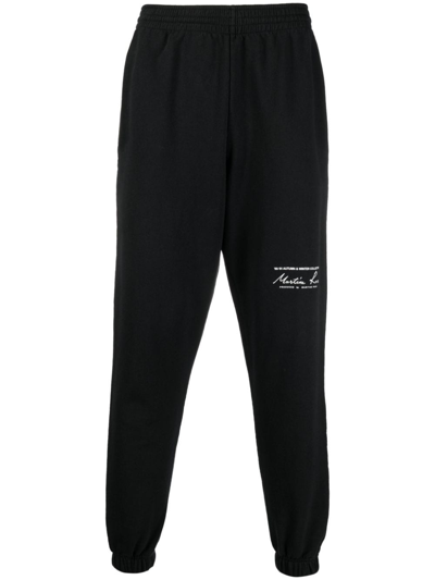 Shop Martine Rose Logo-print Slim-fit Track Pants In Schwarz