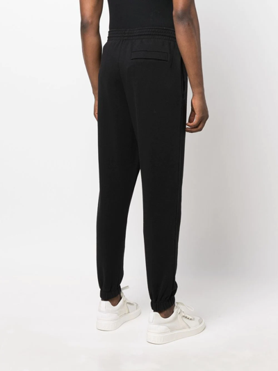 Shop Martine Rose Logo-print Slim-fit Track Pants In Schwarz