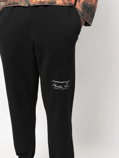 Shop Martine Rose Logo-print Slim-fit Track Pants In Schwarz