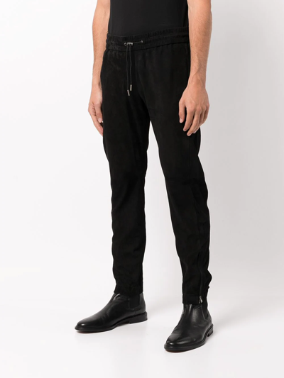Shop Saint Laurent Tapered Suede Track Trousers In Black