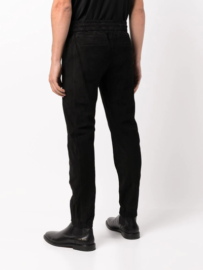 Shop Saint Laurent Tapered Suede Track Trousers In Black