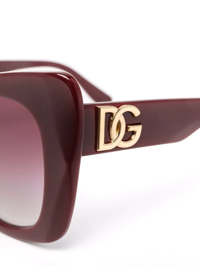 Shop Dolce & Gabbana Logo-plaque Cat-eye Sunglasses In Red