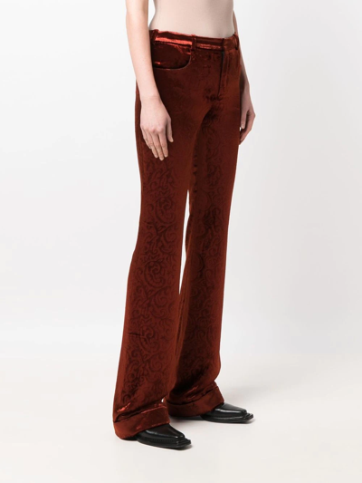 Shop Saint Laurent Flared Velvet Trousers In Orange