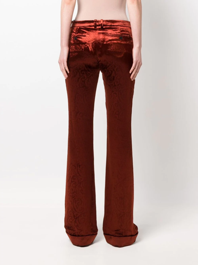 Shop Saint Laurent Flared Velvet Trousers In Orange