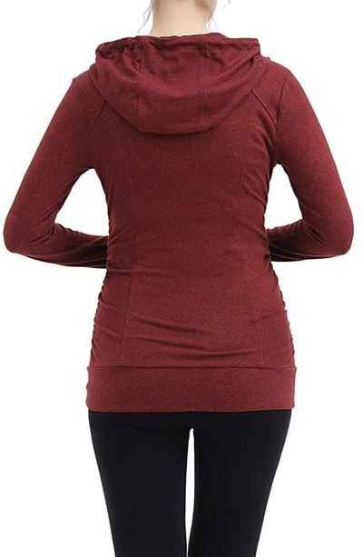 Shop Kimi And Kai Momo Ruched Zip Maternity Hoodie In Maple Red
