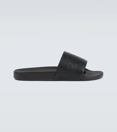 Shop Gucci Gg Rubber Slides In Black