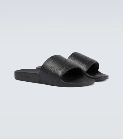 Shop Gucci Gg Rubber Slides In Black