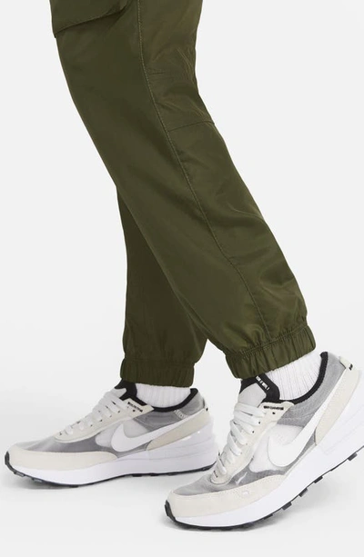 Shop Nike Sportswear Kids' Track Pants In Rough Green/ Black