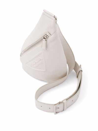 Shop Prada Logo-embossed Cross Backpack In Weiss