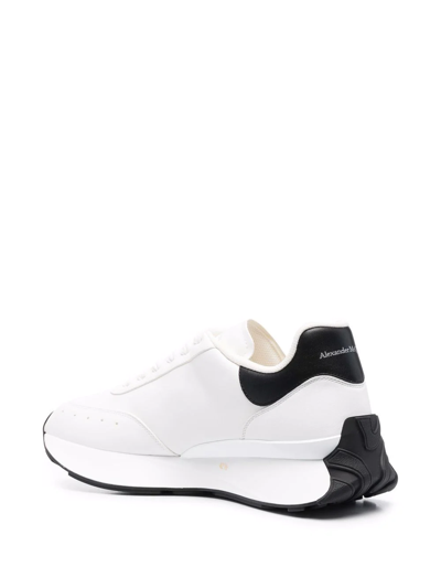 Shop Alexander Mcqueen Embossed Logo Exaggerated-sole Sneakers In Weiss
